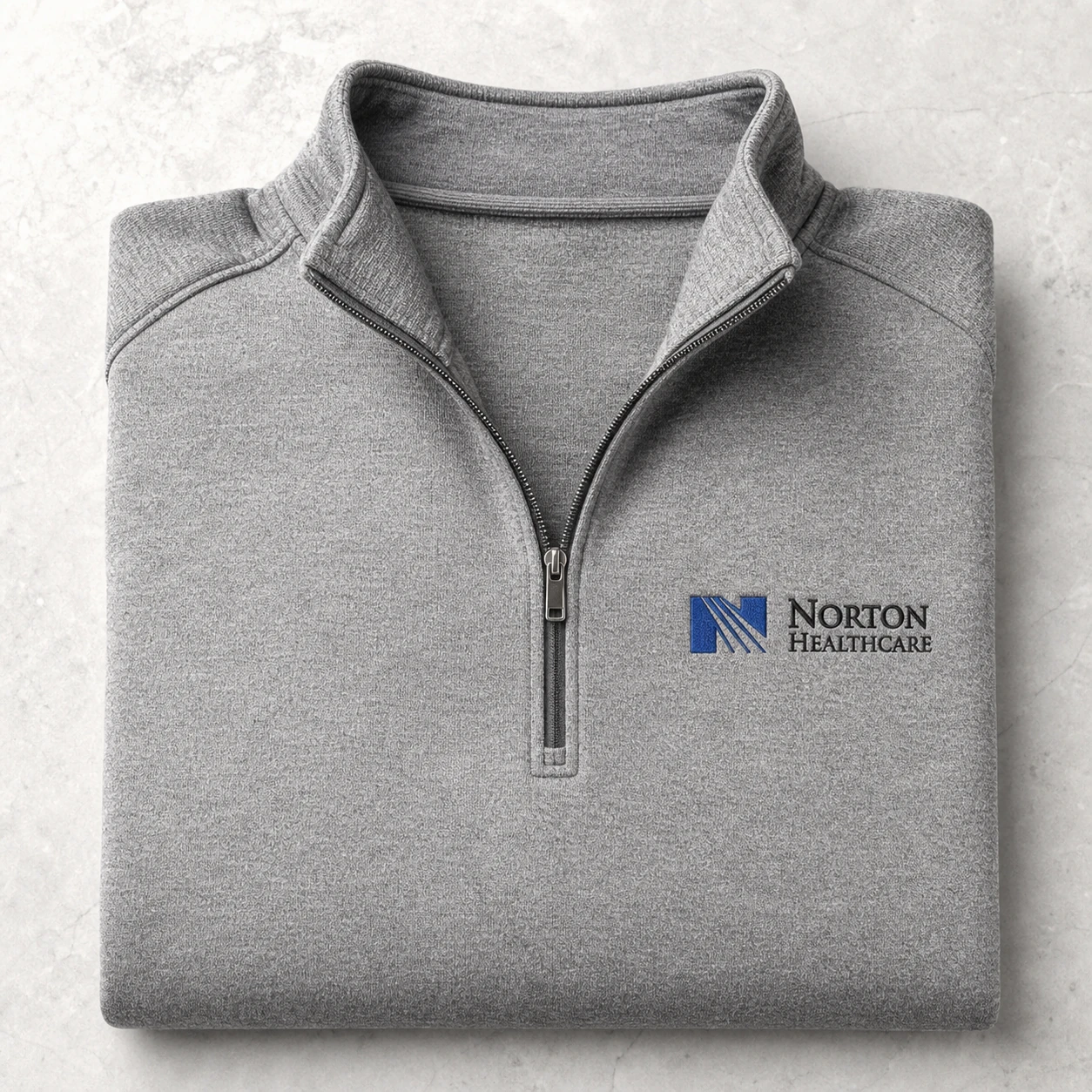 Branded quarter-zip for clinical staff