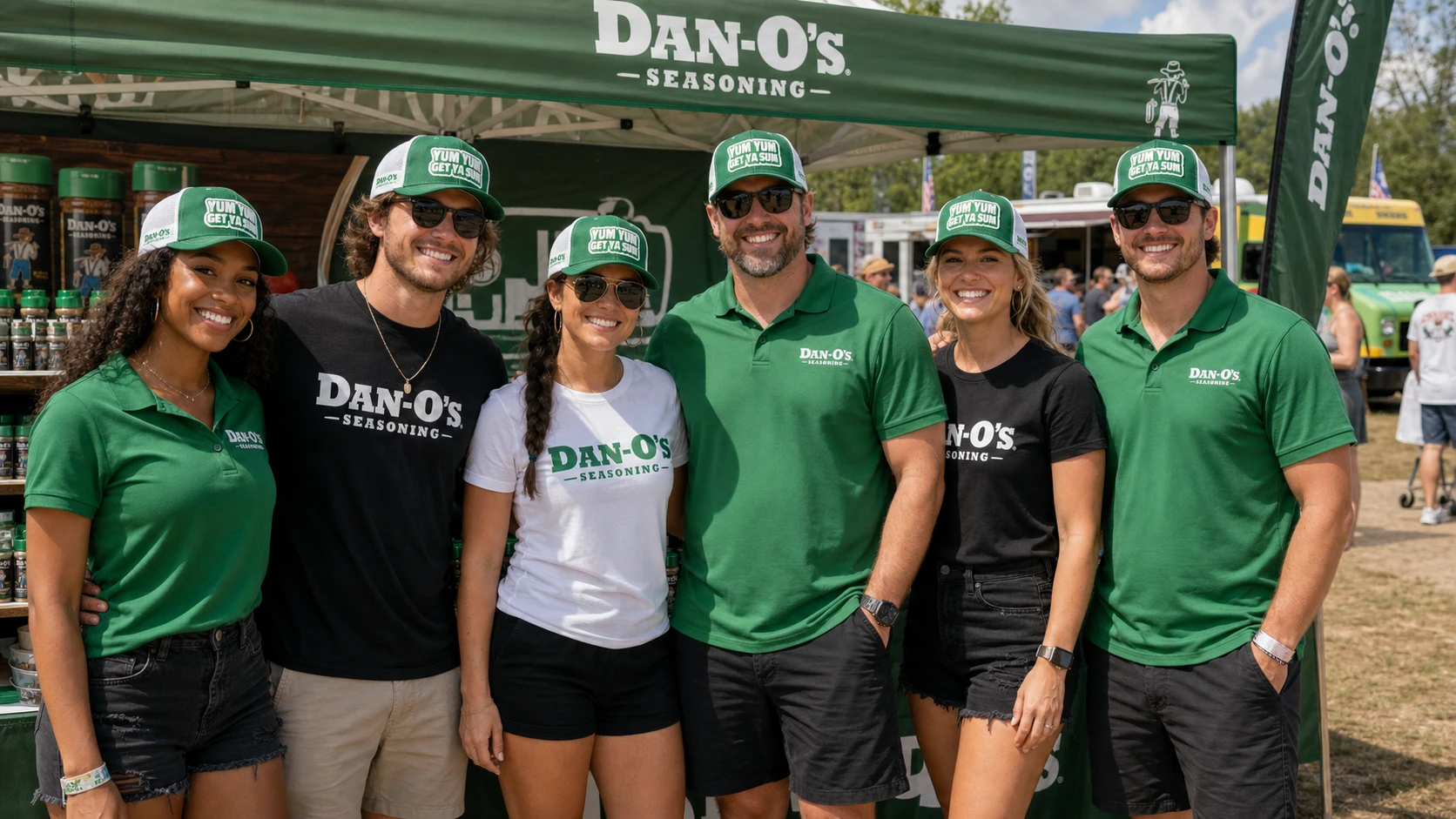 Event team in matching printed tees greeting guests