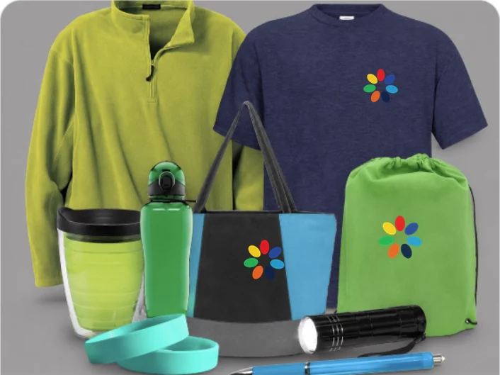 Branded Quality First swag — logo-decorated fleece, tee, tote and drawstring bag with bottle, tumbler and accessories